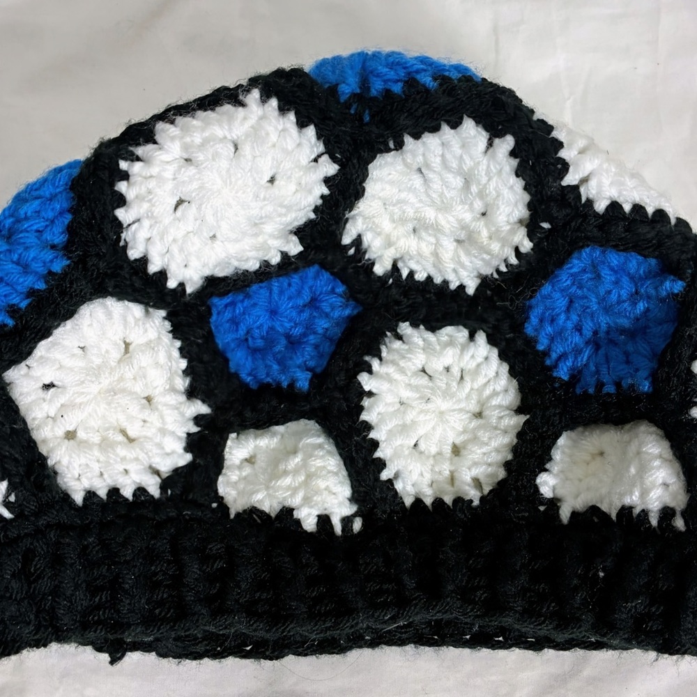 crocheted granny square bucket hat w/ a  soccer ball  or floral pattern. 